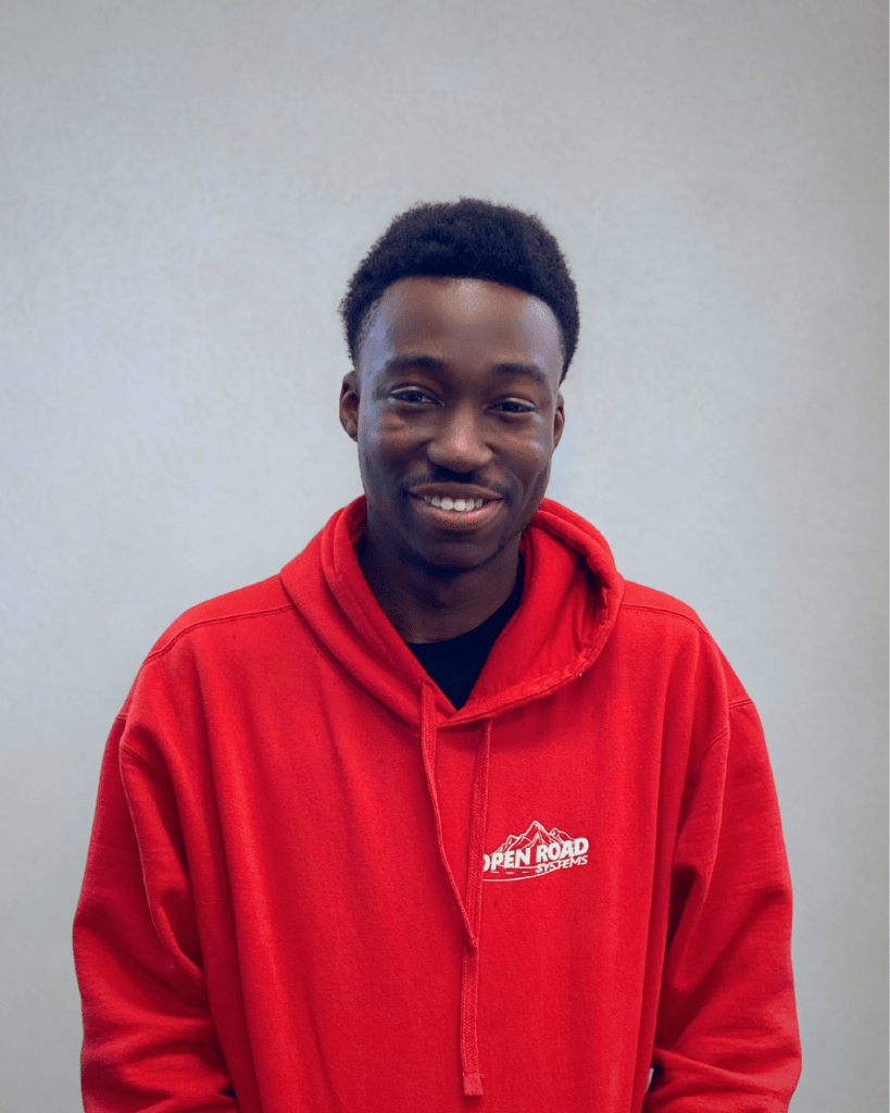 Tyrese from Open Road Systems, a security technician expert in IoT and Access Control, wearing an Open Road Systems branded hoodie.