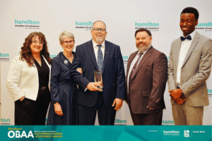 The award-winning team from Open Road Systems, a trusted Hamilton business, celebrating together after receiving the 2026 Small Business of the Year award.